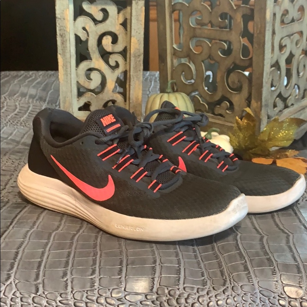 Grey and pink Nike running shoes. Size 9